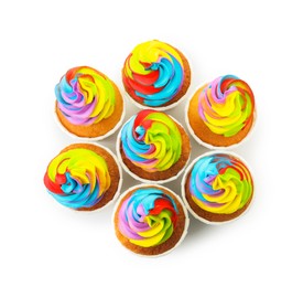 Photo of Tasty cupcakes with colorful cream isolated on white, top view