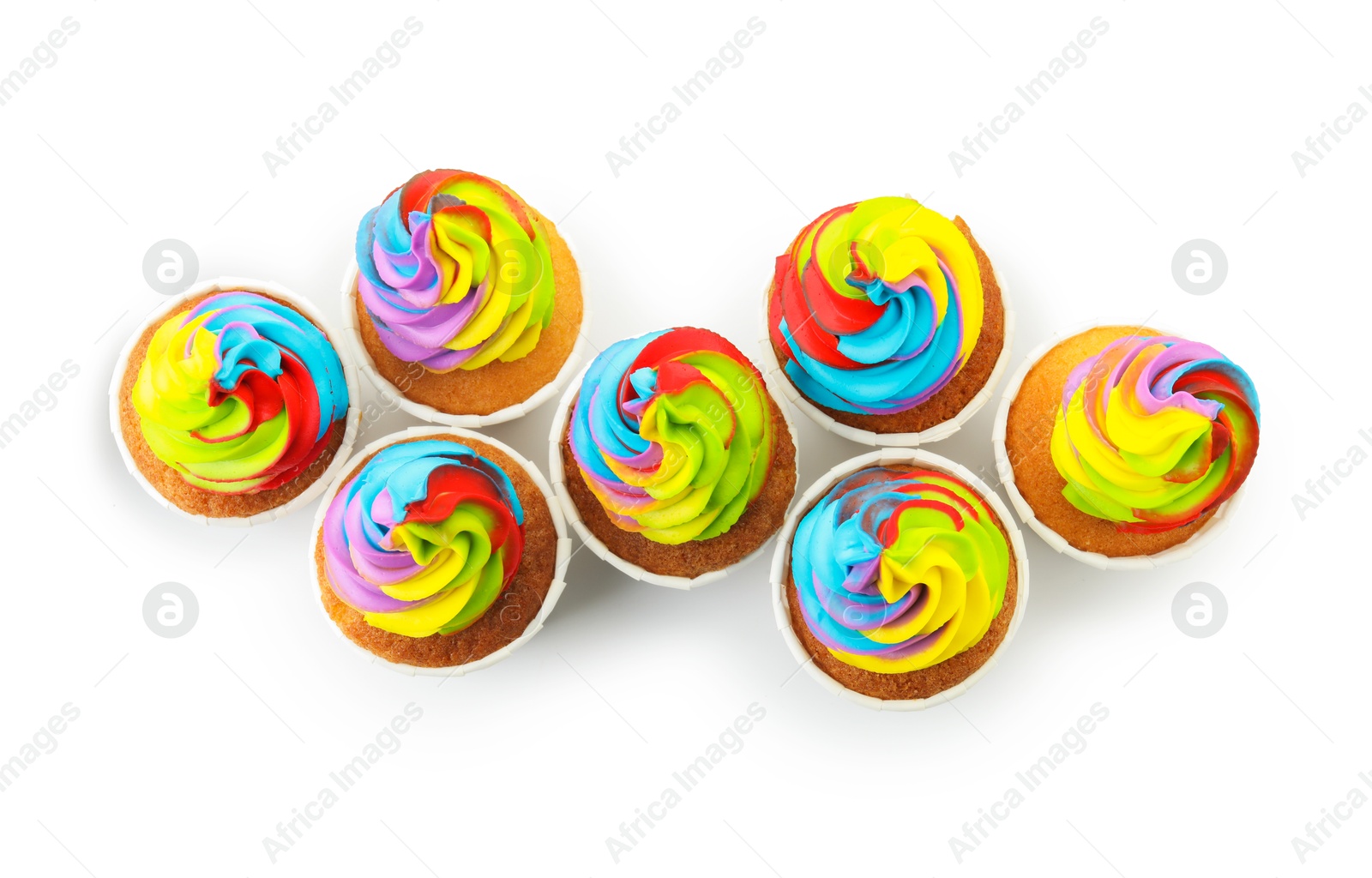 Photo of Tasty cupcakes with colorful cream isolated on white, top view