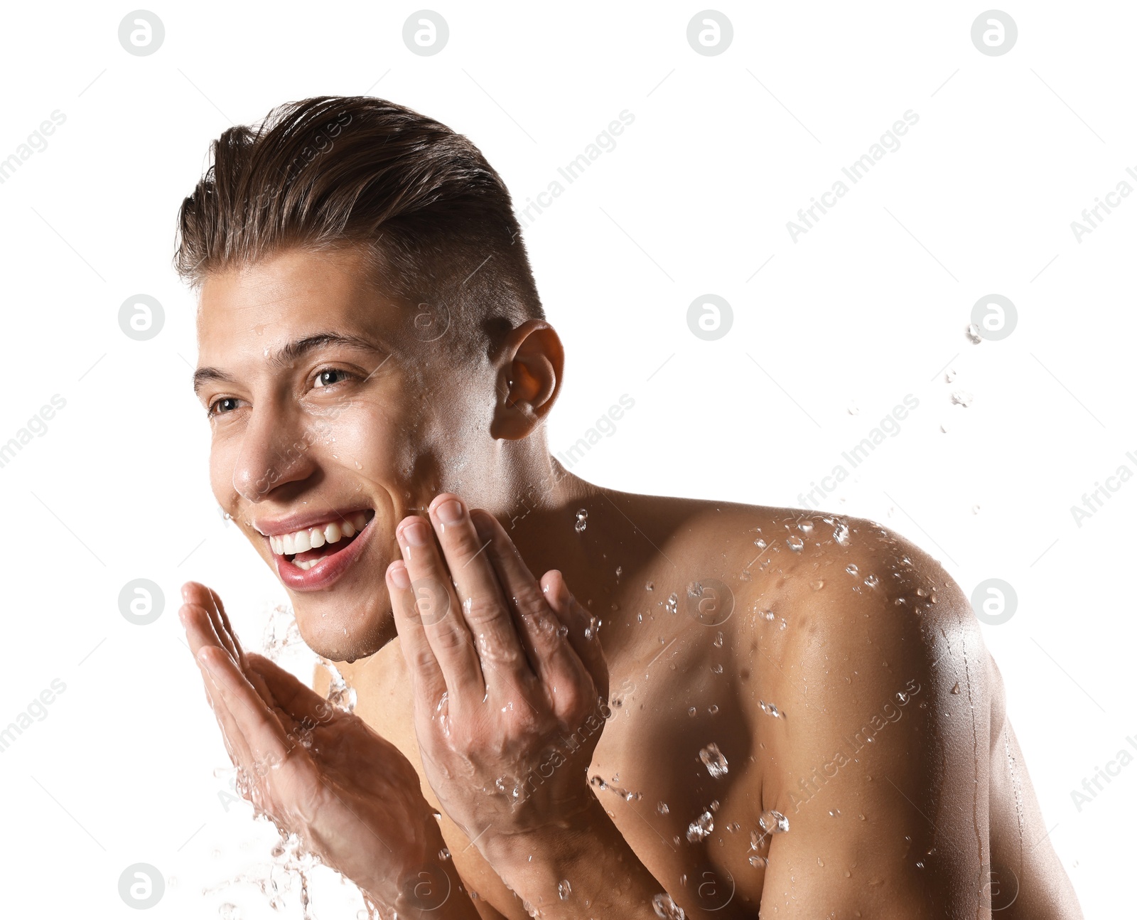 Photo of Smiling man washing his face on white background