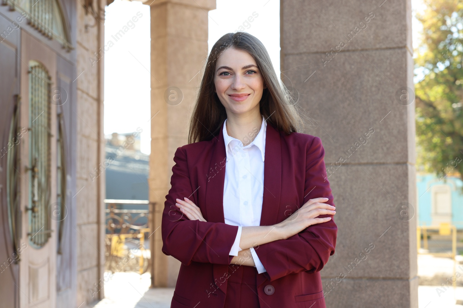 Photo of Portrait of young woman wearing stylish suit outdoors