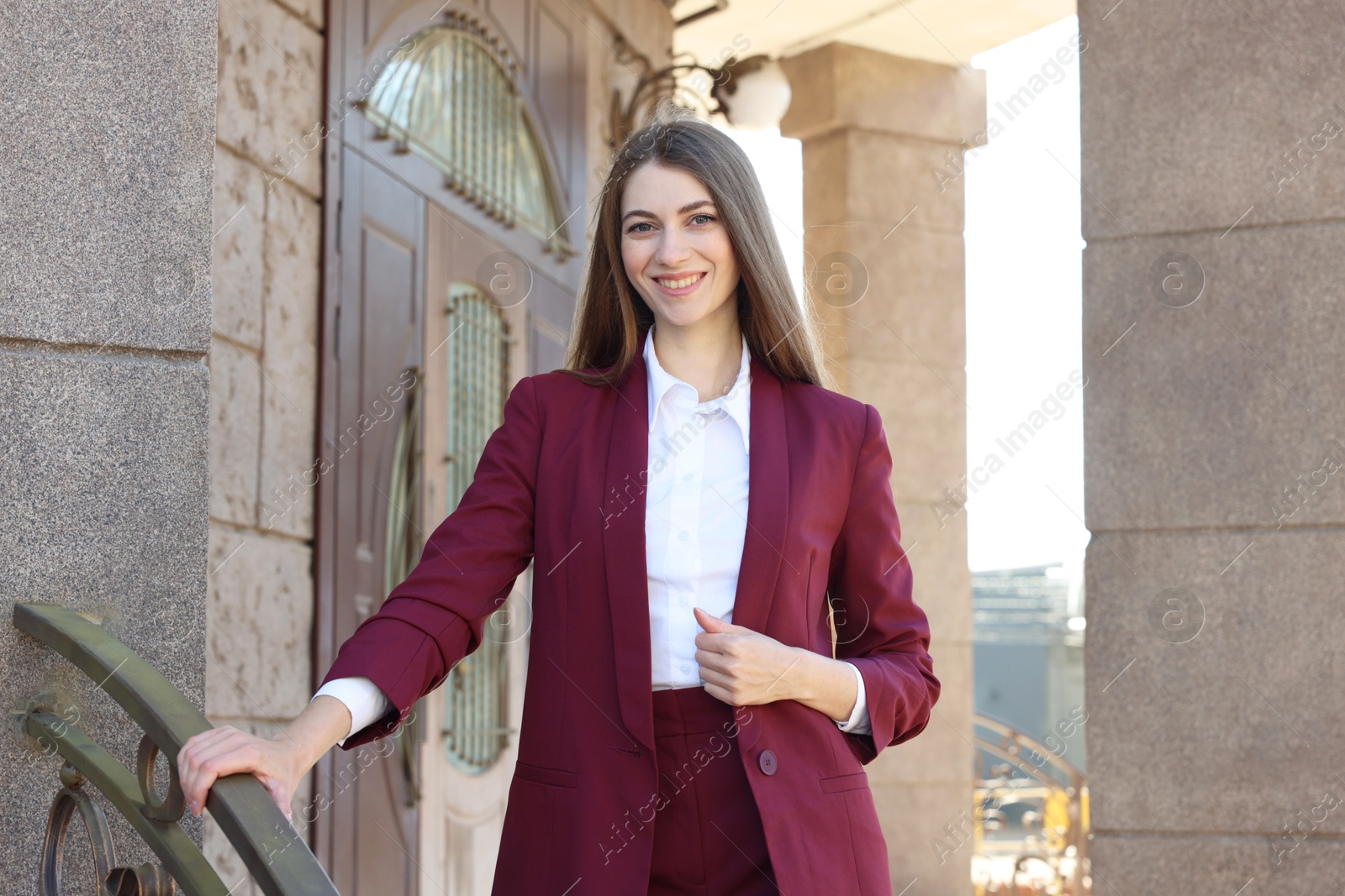 Photo of Portrait of young woman wearing stylish suit outdoors