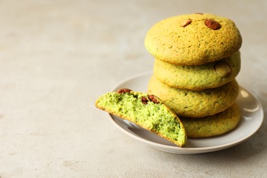 Photo of Delicious mint chocolate chip cookies on light table, closeup. Space for text