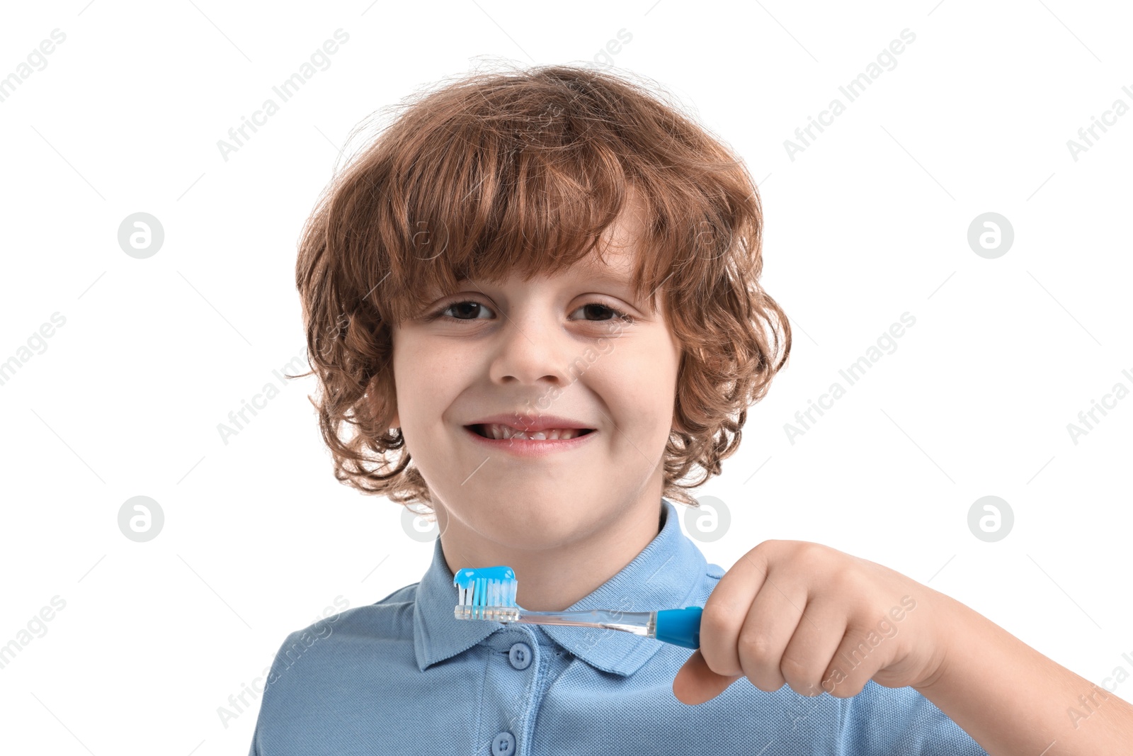 Photo of Cute boy with toothbrush and toothpaste on white background