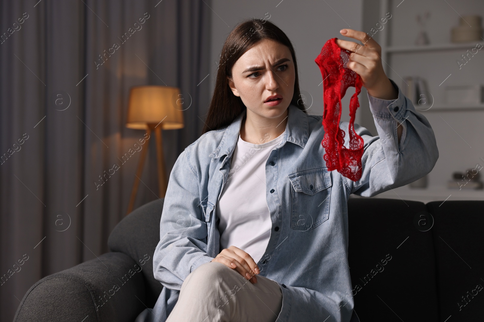 Photo of Surprised wife with mistress panties alone at home