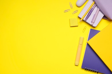 Photo of Different stationery on yellow background, flat lay. Space for text