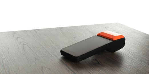 Photo of Payment terminal on wooden table against white background