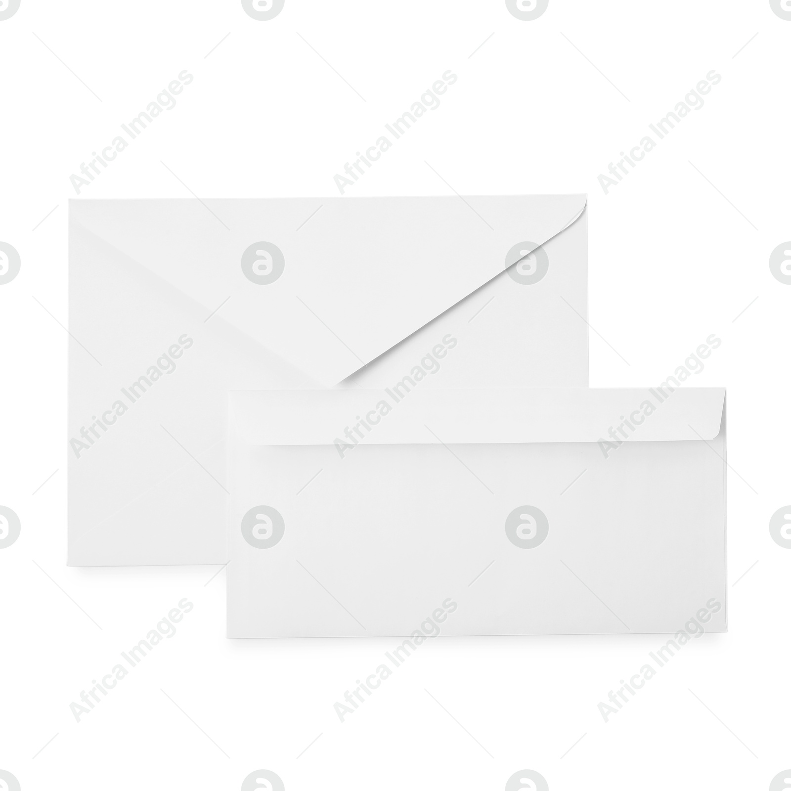 Photo of Envelopes isolated on white, top view. Mockup for design