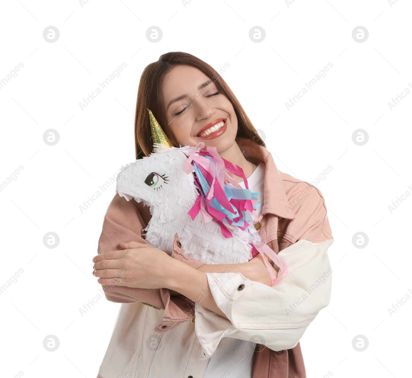 Photo of Happy woman with unicorn shaped pinata isolated on white