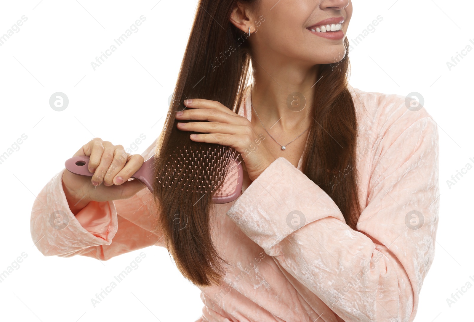 Photo of Woman brushing her hair on white background, closeup