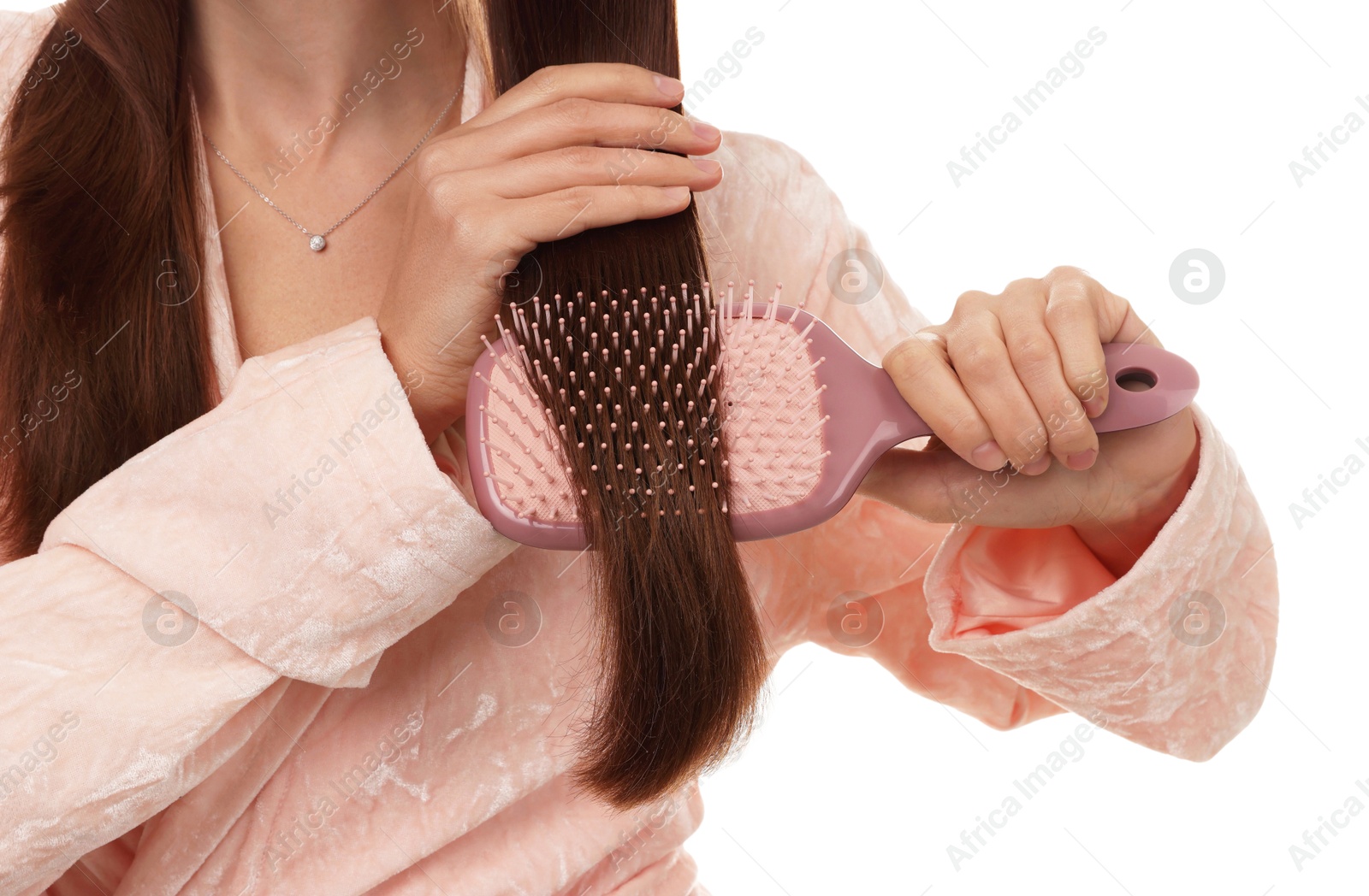 Photo of Woman brushing her hair on white background, closeup