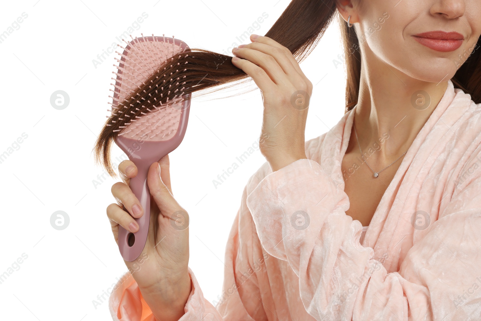 Photo of Woman brushing her hair on white background, closeup