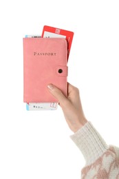 Photo of Woman holding passport with tickets on white background, closeup