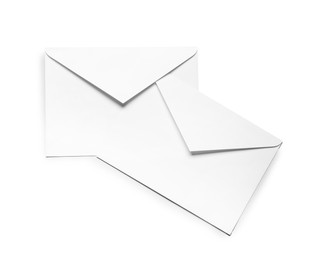 Photo of Envelopes isolated on white, top view. Mockup for design