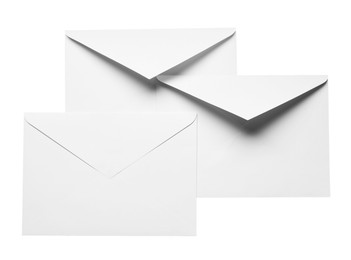 Photo of Envelopes isolated on white, top view. Mockup for design