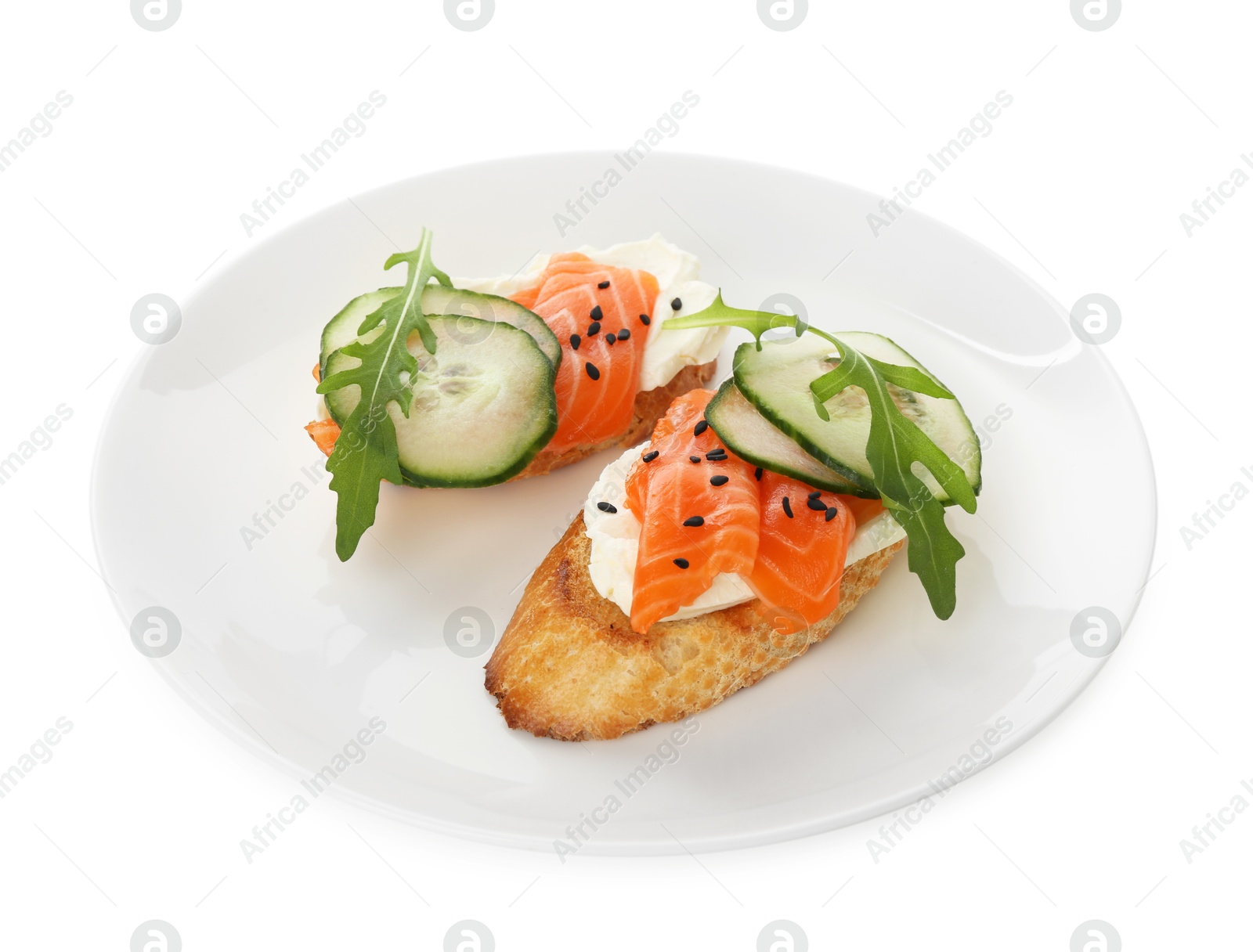 Photo of Delicious bruschette with cream cheese, salmon and cucumber isolated on white