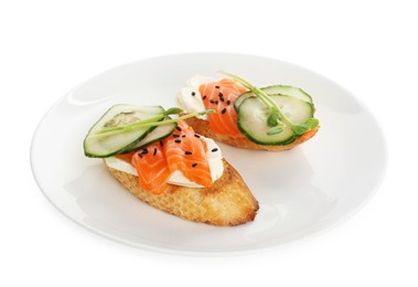 Photo of Delicious bruschette with cream cheese, salmon and cucumber isolated on white