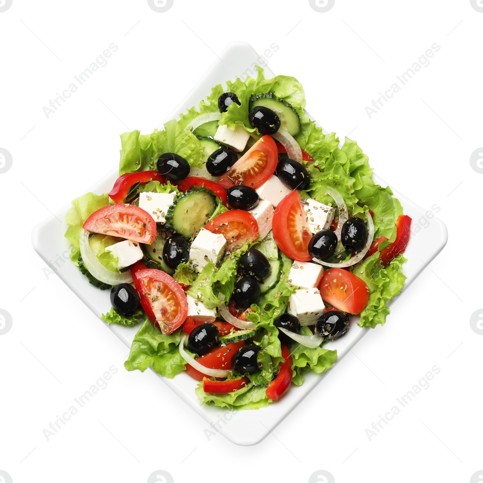 Photo of Delicious fresh Greek salad isolated on white, top view