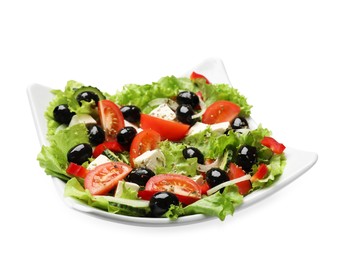 Photo of Delicious fresh Greek salad isolated on white