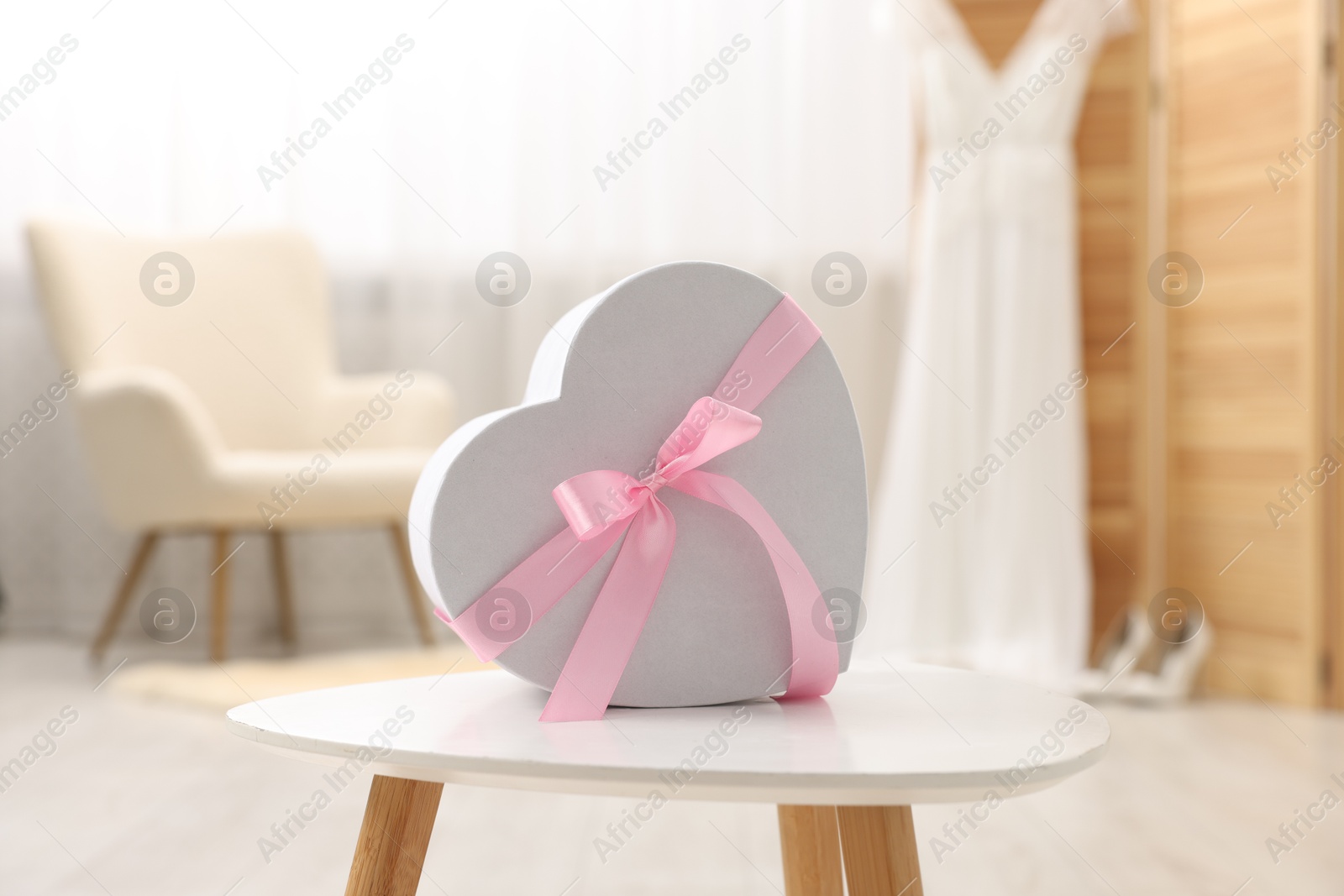 Photo of Gift box for wedding day on white table indoors