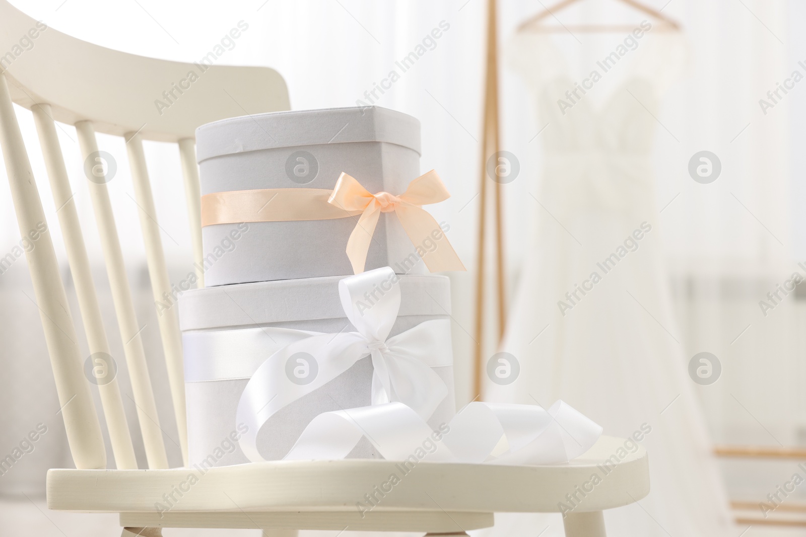 Photo of Gift boxes for wedding day on chair indoors, space for text