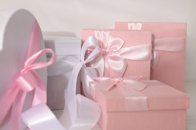 Photo of Gift boxes for wedding day on light background, closeup