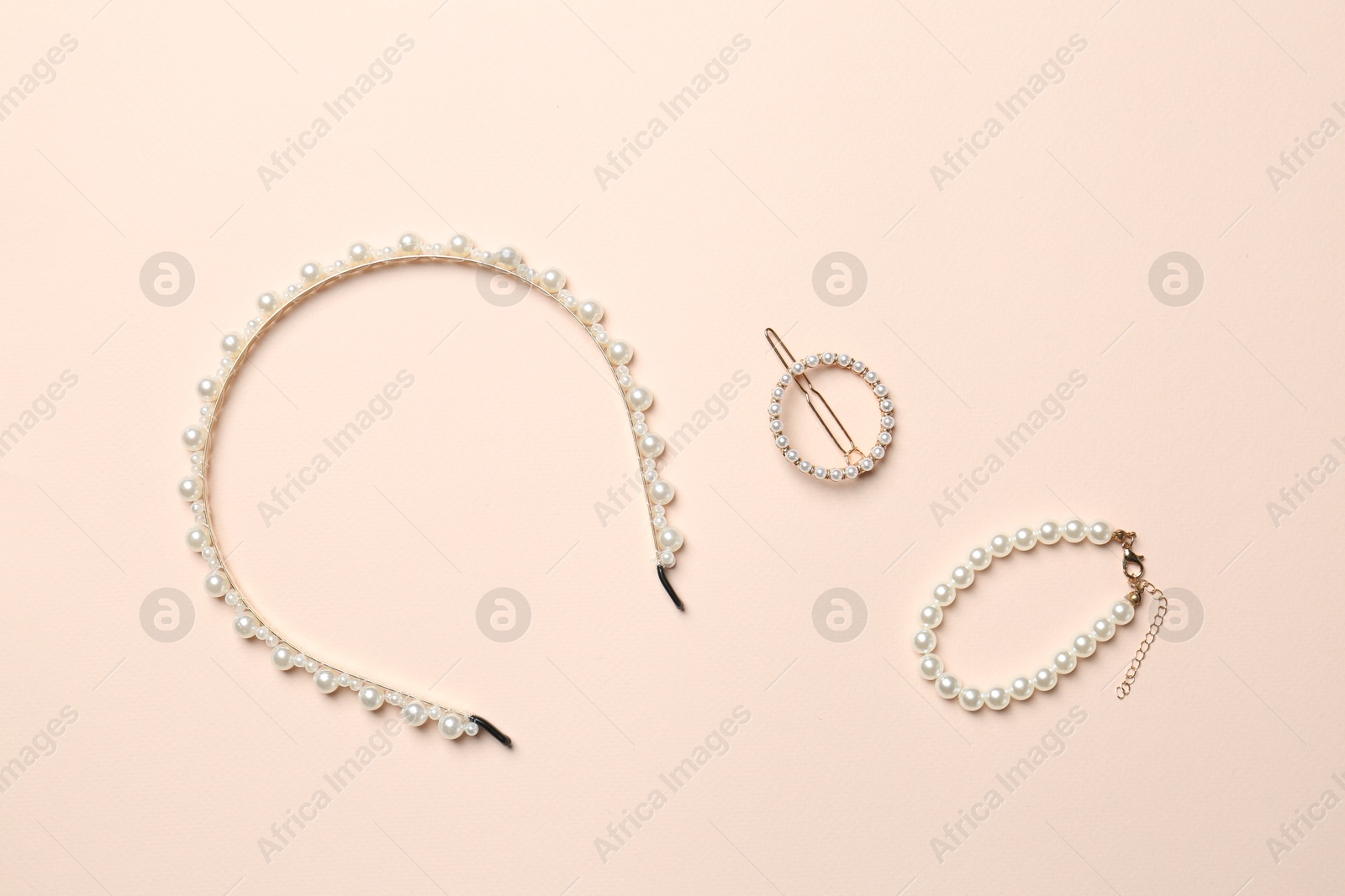 Photo of Stylish accessories on beige background, flat lay