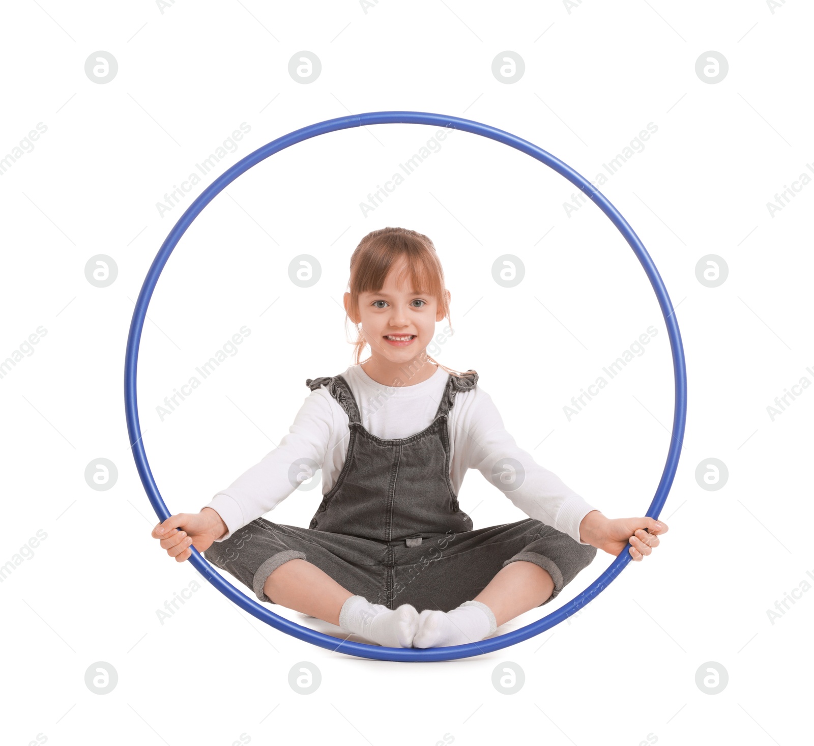 Photo of Cute little girl with hula hoop on white background