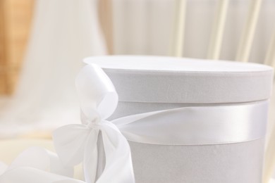 Photo of Gift box for wedding day on blurred background, closeup