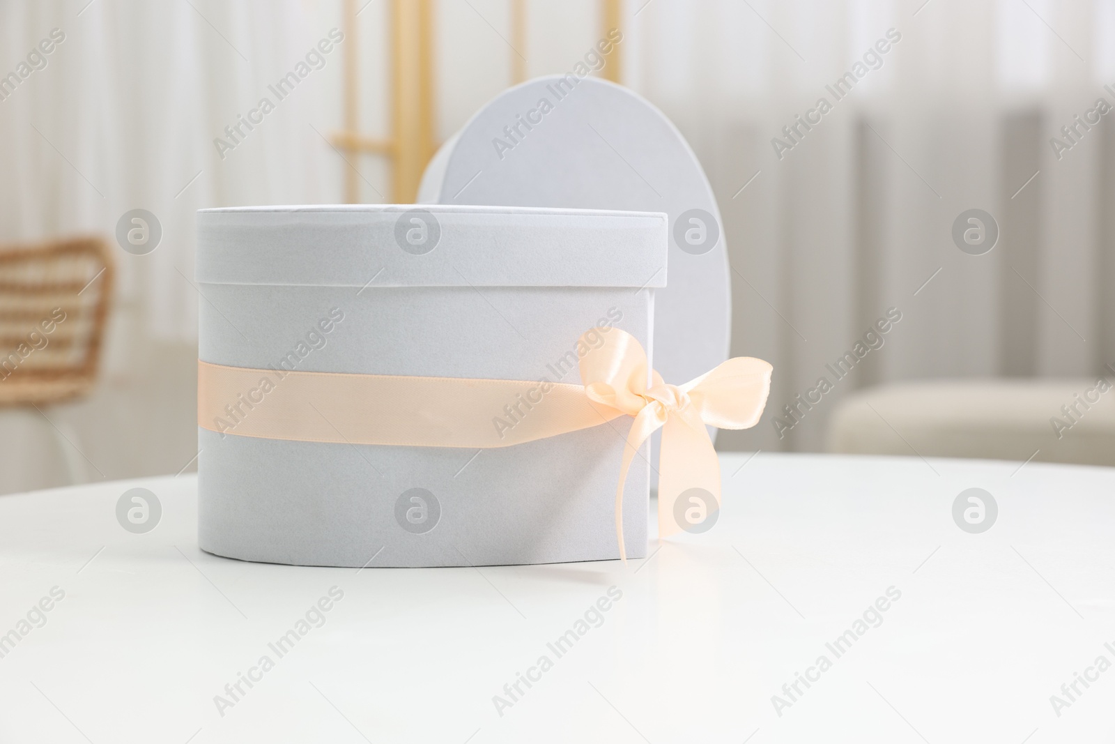 Photo of Gift boxes for wedding day on white table indoors, space for text