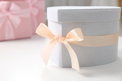 Photo of Gift box for wedding day on white table indoors, closeup. Space for text