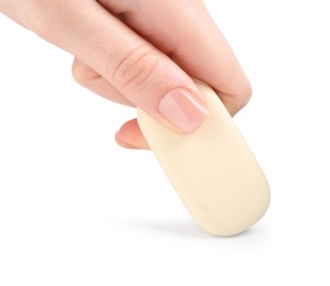 Photo of Woman using eraser on white background, closeup