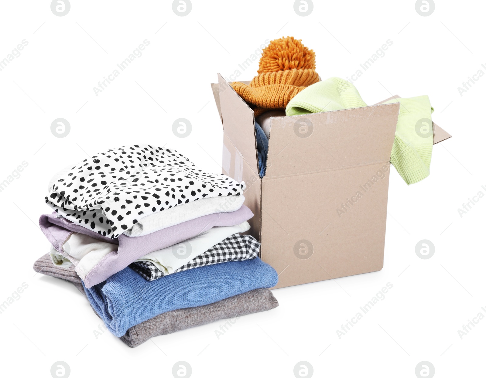 Photo of Box with different used clothes isolated on white