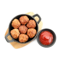 Photo of Tasty meatballs in baking dish and tomato sauce isolated on white, top view