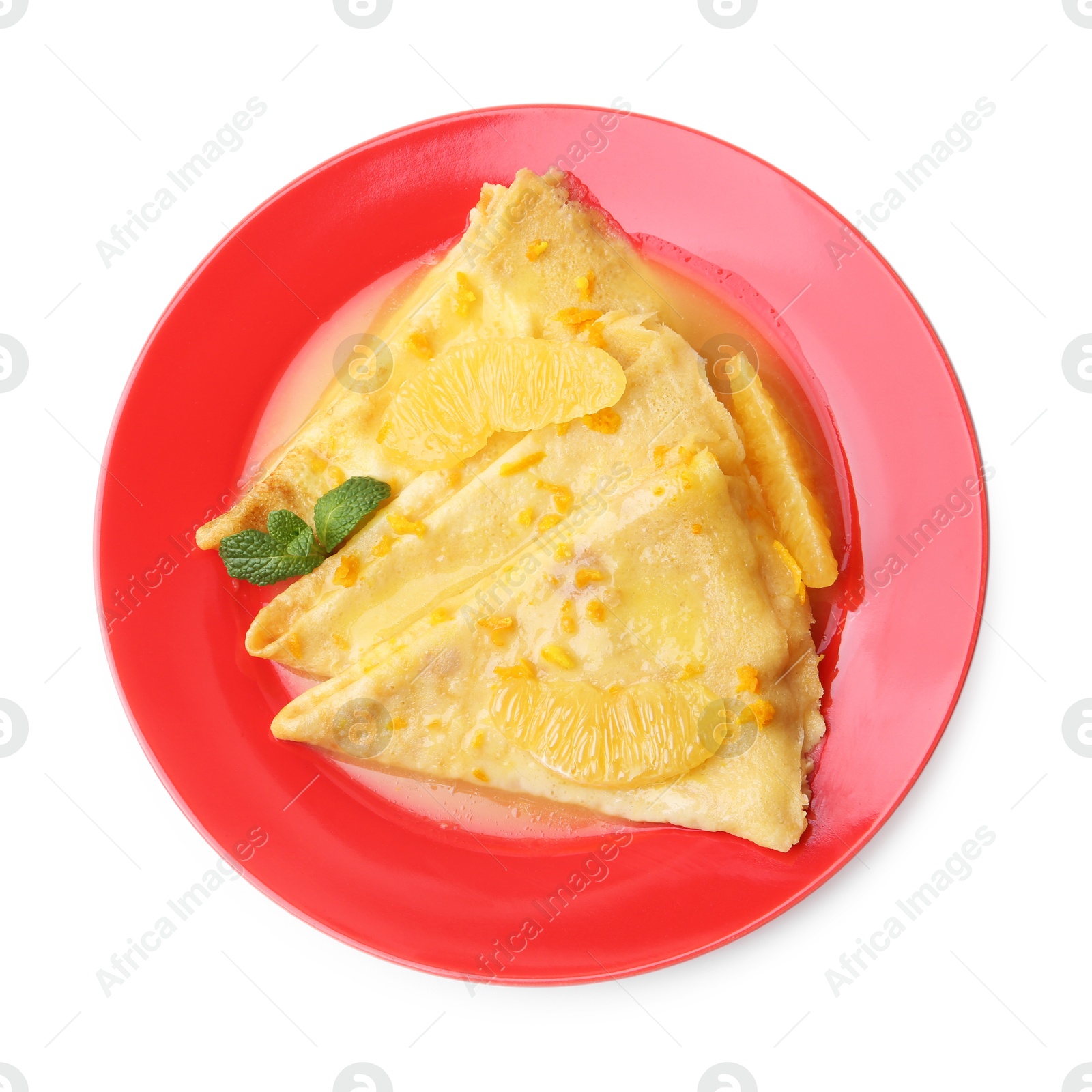 Photo of Plate with tasty crepes Suzette isolated on white, top view