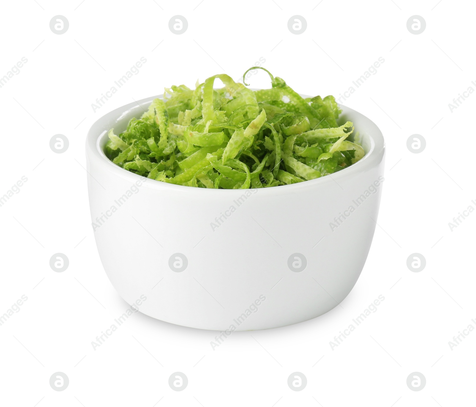 Photo of Fresh lime zest in bowl isolated on white