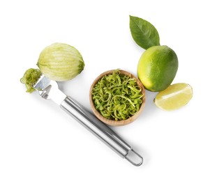 Photo of Lime zest, fresh fruits and zester tool isolated on white, top view