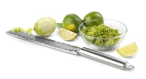 Photo of Lime zest, grater and fresh fruits isolated on white