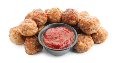 Photo of Pile of delicious meatballs and bowl with ketchup isolated on white