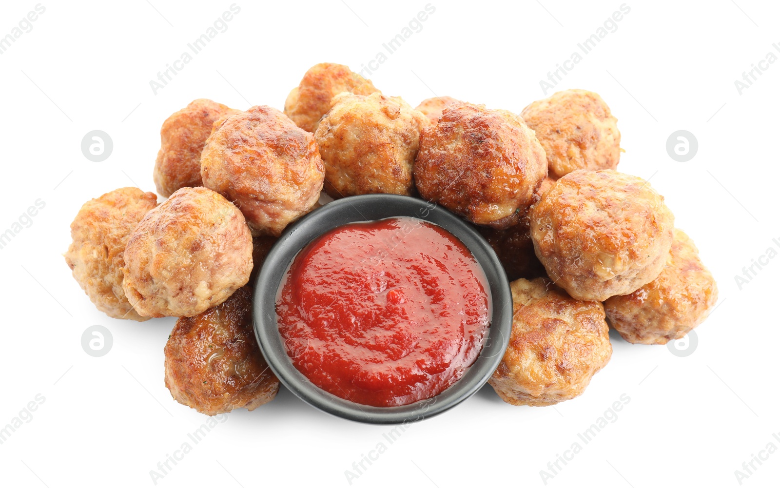 Photo of Pile of delicious meatballs and bowl with ketchup isolated on white, above view