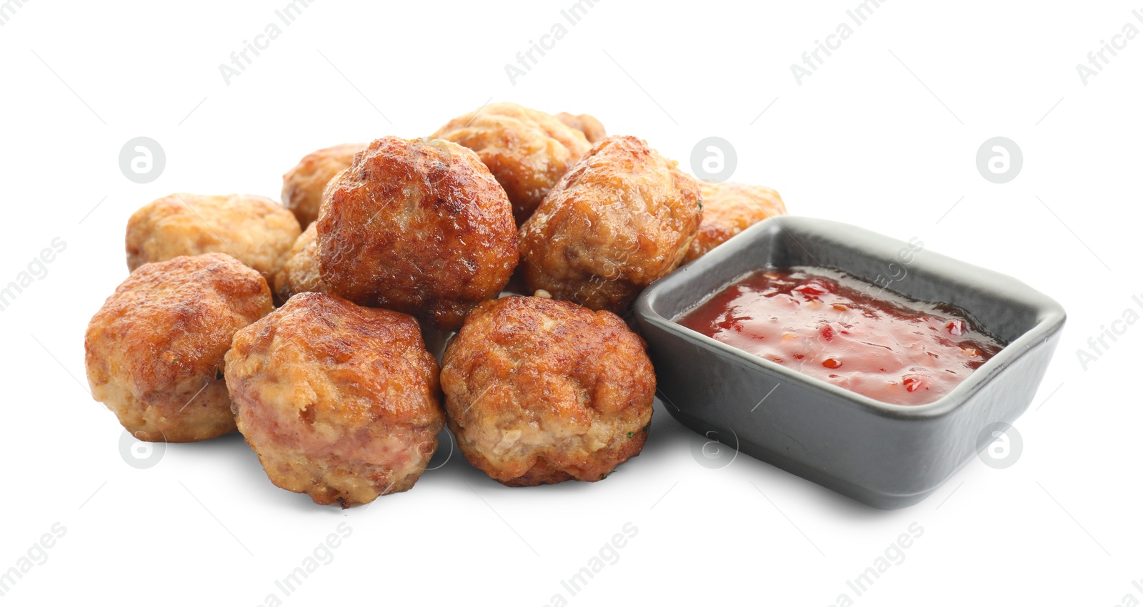 Photo of Pile of delicious meatballs and bowl with ketchup isolated on white