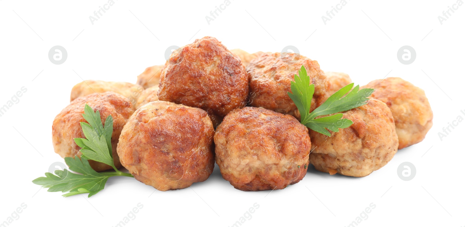 Photo of Pile of delicious meatballs and parsley isolated on white