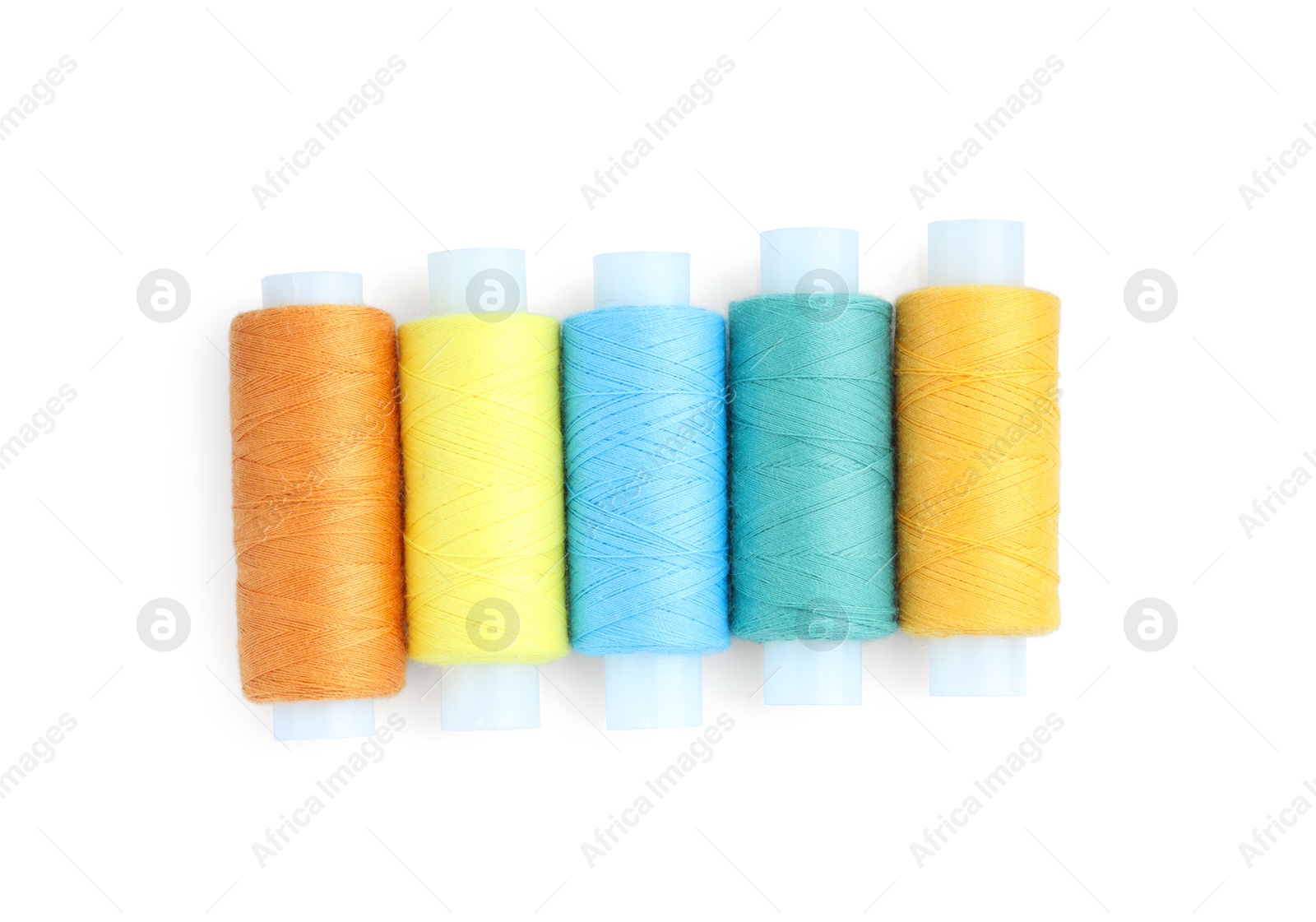 Photo of Spools of bright sewing threads isolated on white, top view