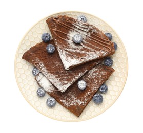 Photo of Delicious chocolate crepes with blueberries isolated on white, top view