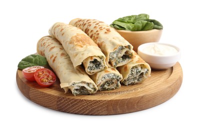 Tasty rolled crepes with cottage cheese, spinach and tomato isolated on white