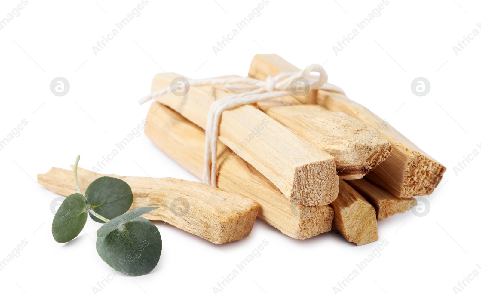 Photo of Palo santo sticks and eucalyptus branch isolated on white