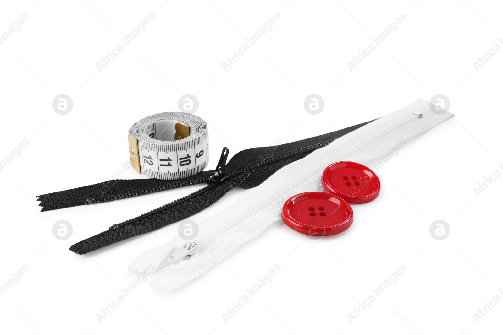 Photo of Sewing supplies. Zippers, measuring tape and buttons isolated on white