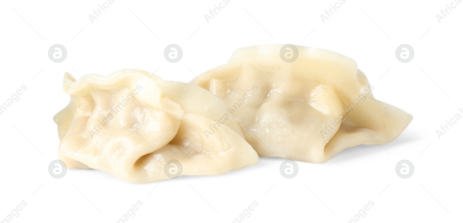 Photo of Tasty boiled gyoza (dumplings) isolated on white