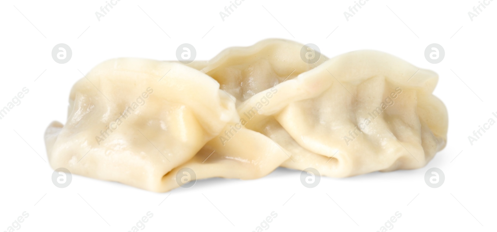 Photo of Tasty boiled gyoza (dumplings) isolated on white