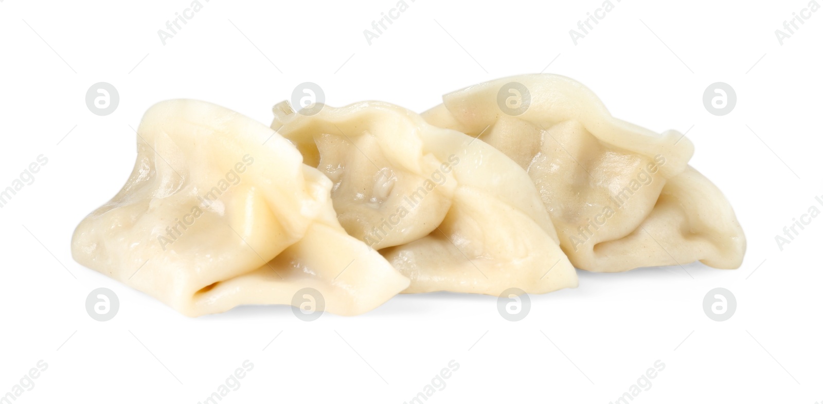 Photo of Tasty boiled gyoza (dumplings) isolated on white