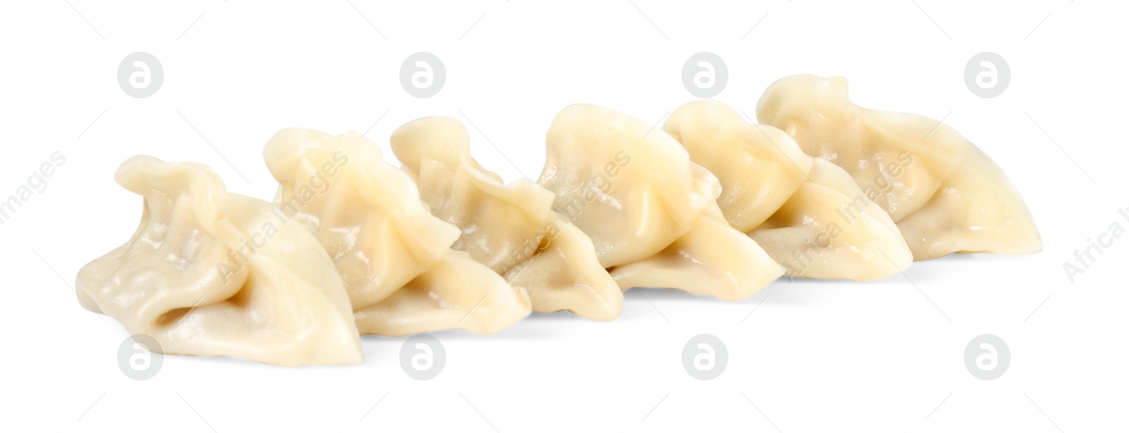 Photo of Tasty boiled gyoza (dumplings) isolated on white